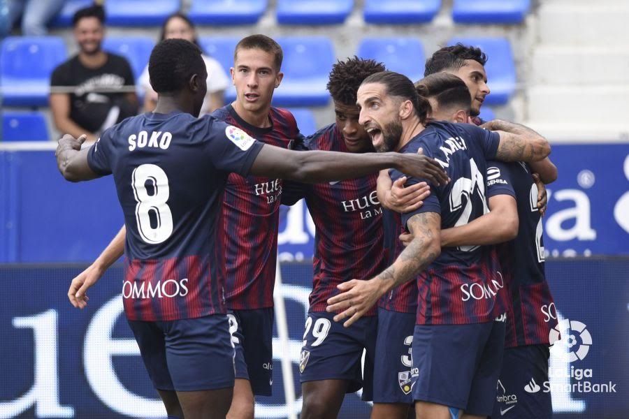 Los jugadores del Huesca celebran el gol de Juan Carlos. Los jugadores del Huesca celebran el gol de Juan Carlos.