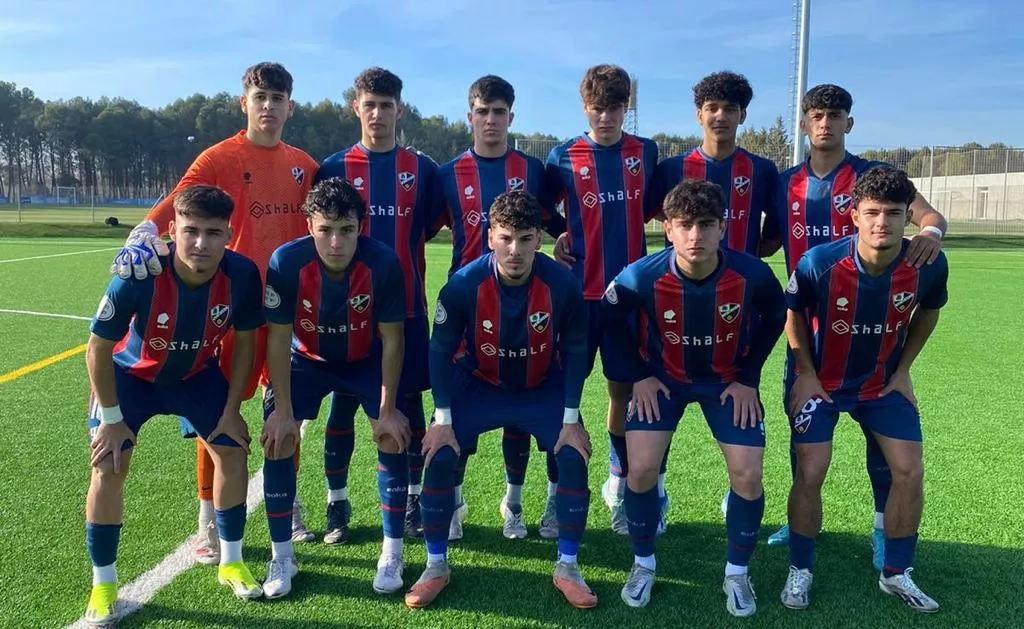 Once del Huesca DHJ ante la Damm.