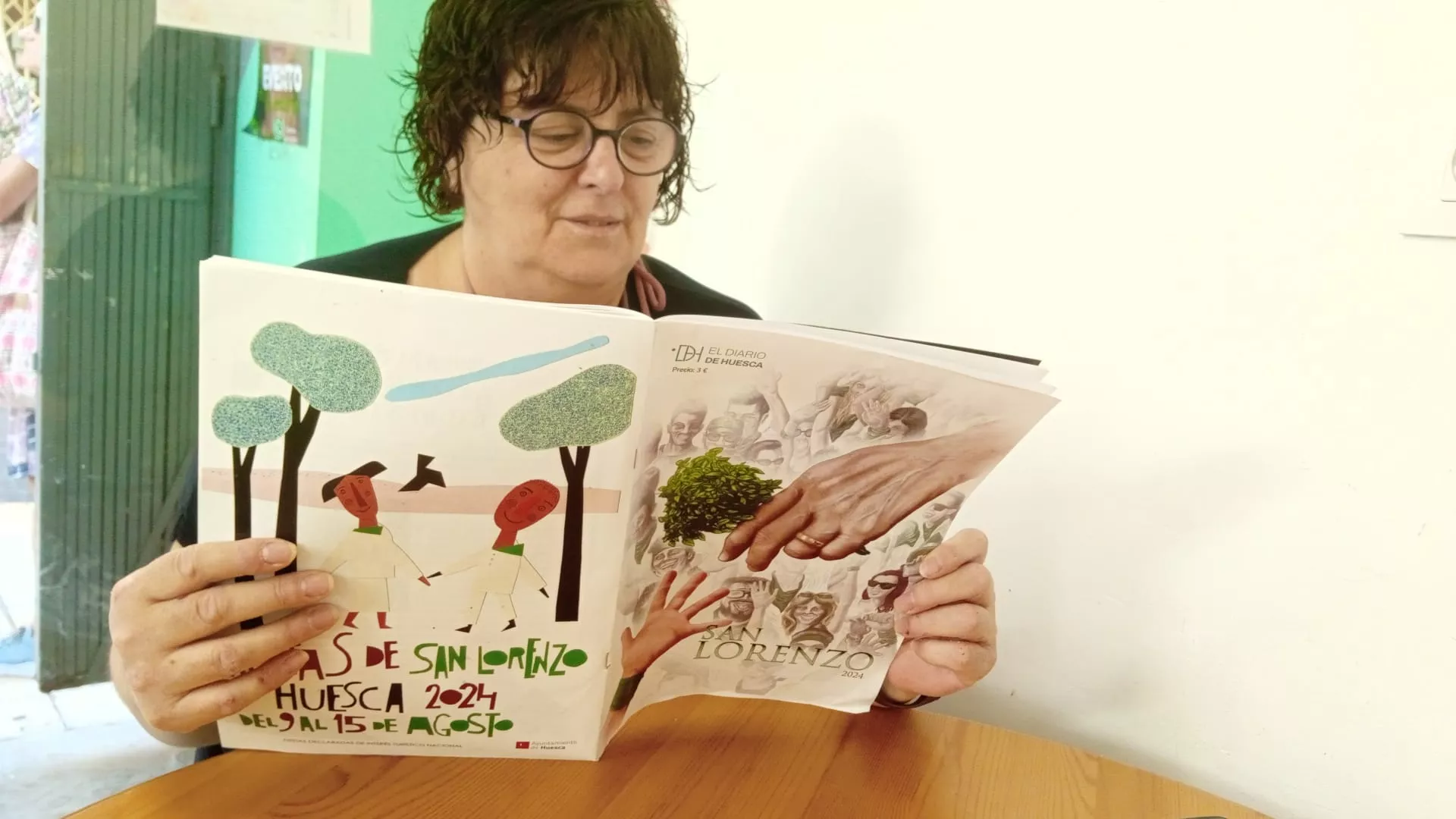 Nuestros lectores con la revista de San Lorenzo de EL DIARIO DE HUESCA.