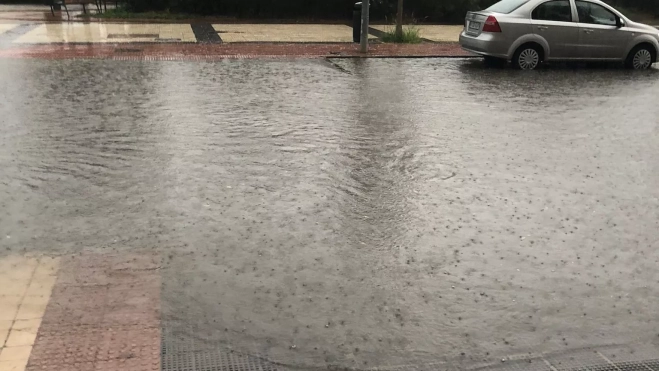 Una calle inundada en Huesca Una calle inundada en Huesca