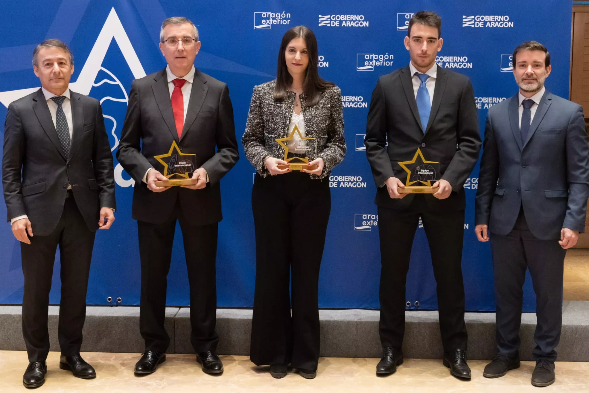 Javier Martínez y Javier Camo, con los galardonados de los Premios Arex 2024