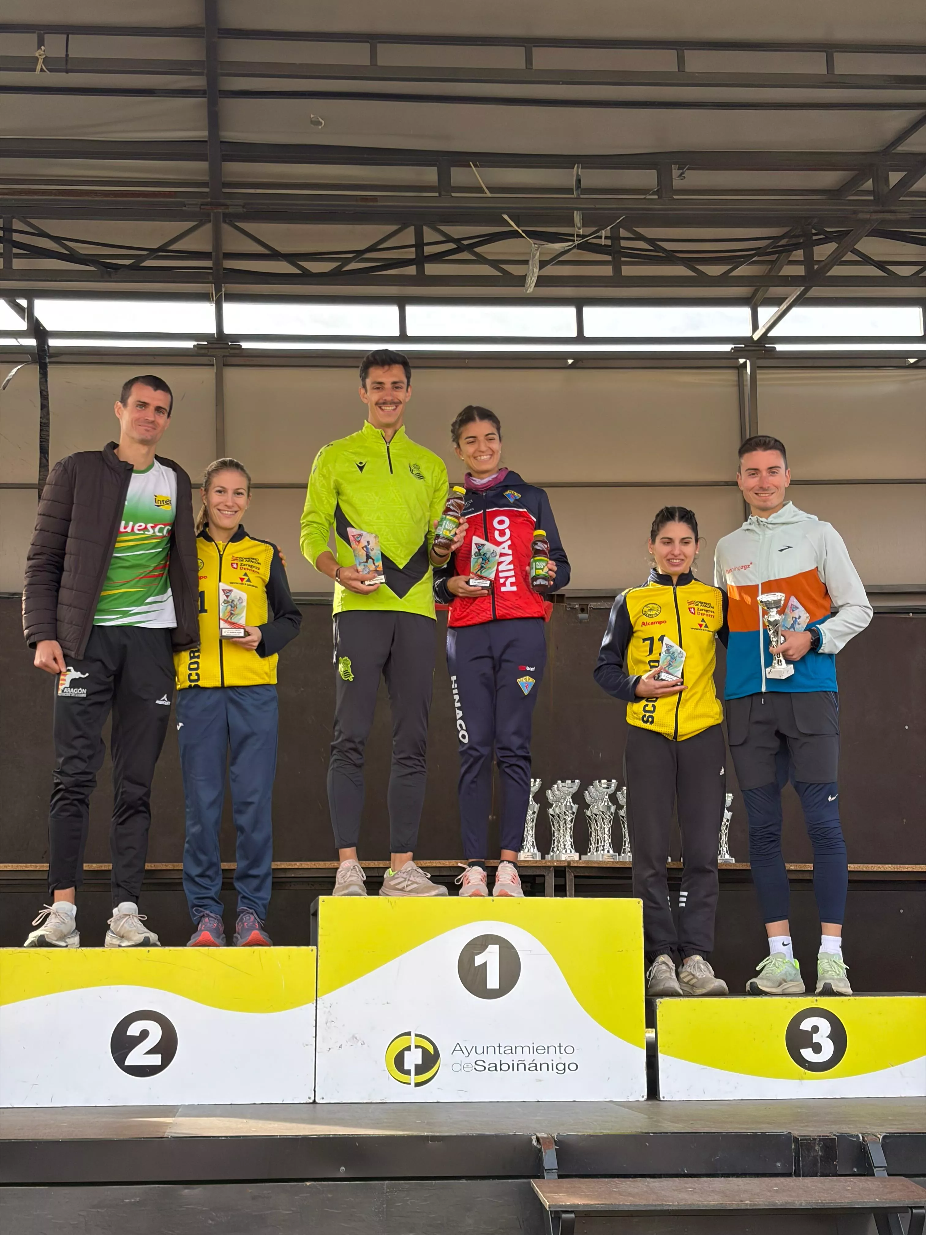 Podio absoluto masculino y femenino